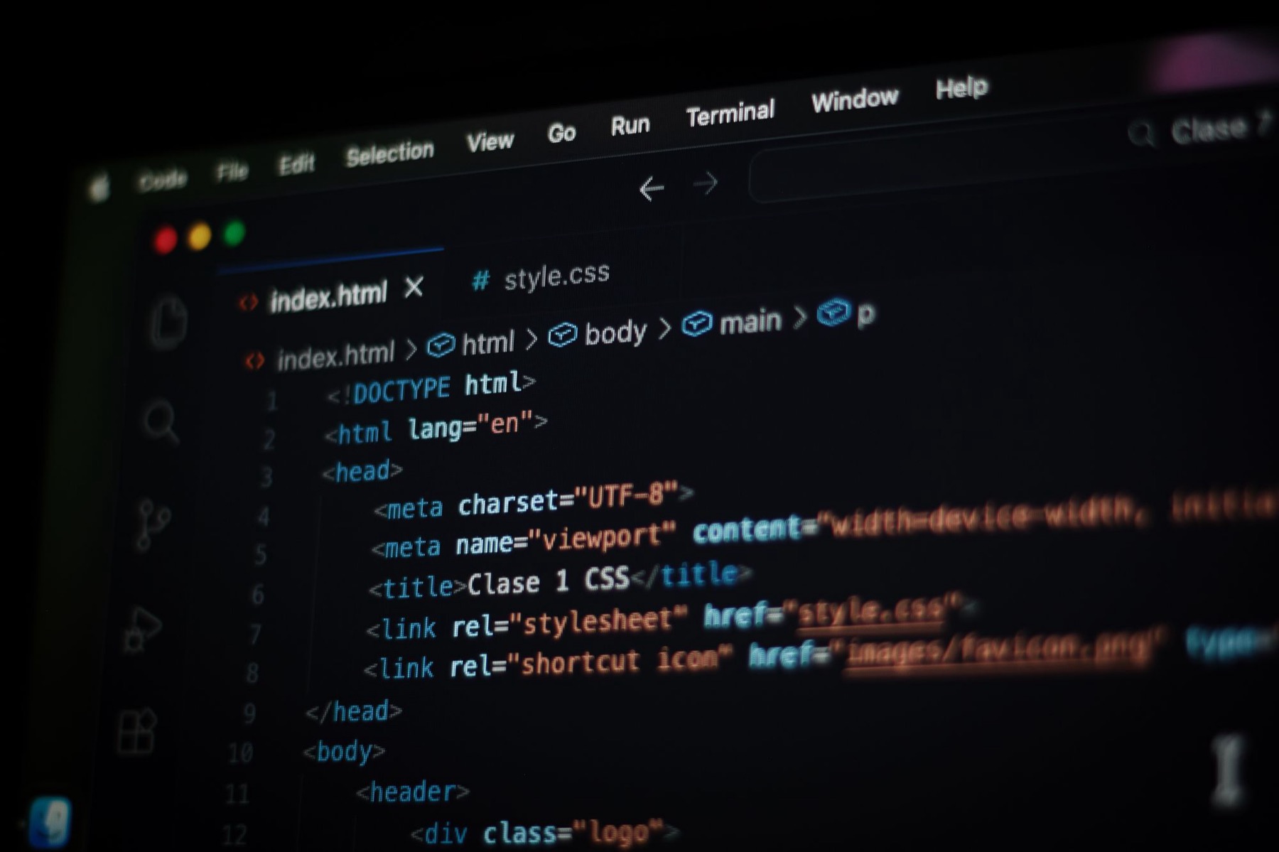 HTML code open in a code editor on a computer screen in dark mode.